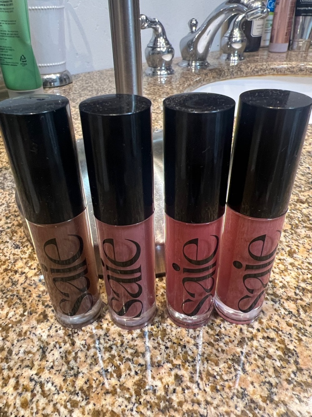 Set of 4 SAIE GLOSSY BOUNCE LIP GLOSSES.